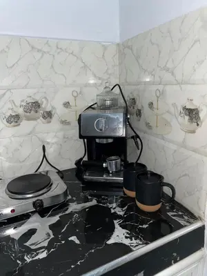 a kitchen with a stove top with pots and pans at Marrakech Oasis Retreat in Marrakech