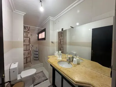 a bathroom with a sink and a toilet at appartement Lamrani in Marrakech