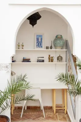 a white desk in a room with plants at Riad Dar Wildeve in Marrakech