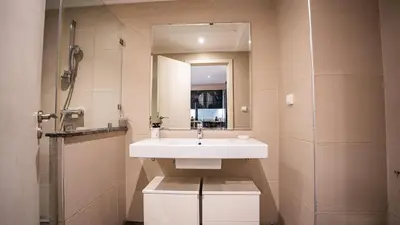 a bathroom with a sink and a mirror at Grand T2, terrasse au coeur de Gueliz in Marrakech