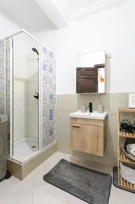 a bathroom with a shower and a sink at Artisan's Hideaway Marrakech in Marrakech