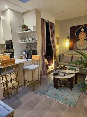 a living room with a couch and a table at Séjour au cœur de la medina in Marrakech
