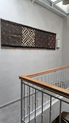 a blanket hanging on a wall in a room at Séjour au cœur de la medina in Marrakech