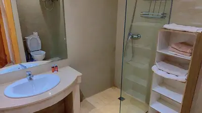 a bathroom with a sink and a glass shower at Hivernage Cosy in Marrakech