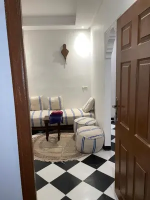 a living room with a couch and a table at Mini Studio in Marrakech