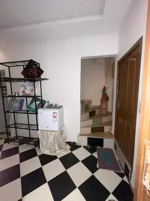 a room with a black and white checkered floor at Mini Studio in Marrakech