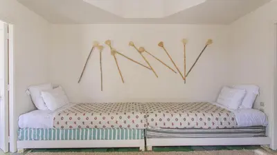 a bedroom with a bed with skis on the wall at Dar Z5 3 bedrooms in Marrakech