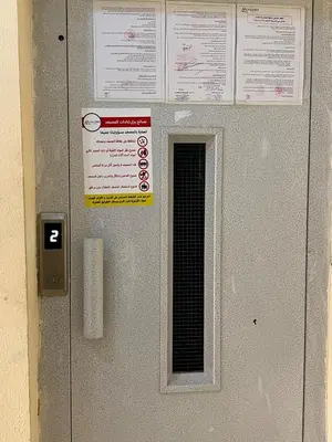 a door with a sign on it with a window at Appartement Marrakech in Marrakech