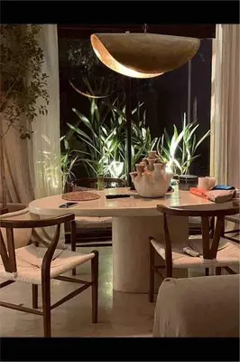 a table with two chairs and a bowl on it at Marrakech Apartment with garden Marrakech in Marrakech