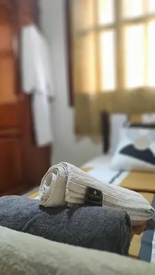 a white toothbrush sitting on top of a bed at Steps from Airport only 5 minutes ,Ideal for Travelers in Marrakech