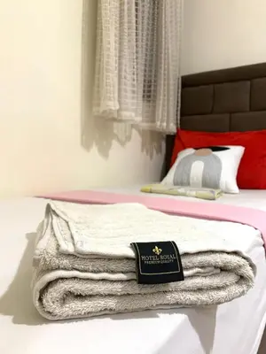 a pile of towels sitting on top of a bed at Steps from Airport only 5 minutes ,Ideal for Travelers in Marrakech