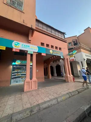 two people walking in front of a building at Steps from Airport only 5 minutes ,Ideal for Travelers in Marrakech