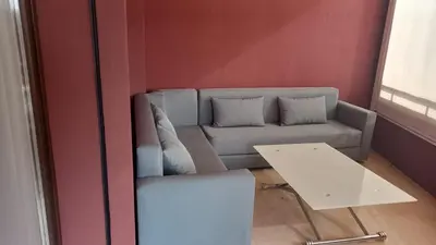 a living room with a couch and a table at Appartement centre Marrakech in Marrakech