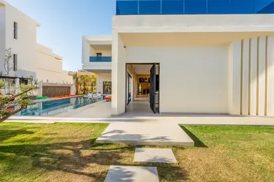 an external view of a house with a yard at Luxury Villa Heated Pool, Cinema & Game Room in Marrakech
