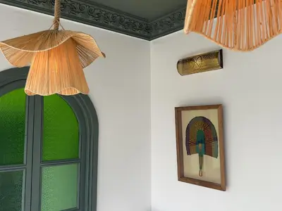 a room with a picture and a window at Riad Kaya in Marrakech