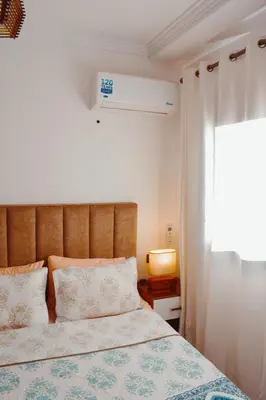a bedroom with a bed and a window at Appartement Marrakech in Marrakech