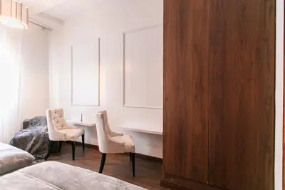 a bedroom with a desk and two chairs and a bed at Prestige Zone Marrakech in Marrakech