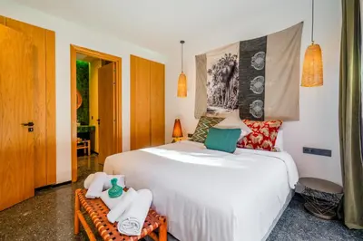 a bedroom with a large white bed with towels on it at Villa Nomade - 4 BR BA - Piscine - Parking - Ourika in Sraghna