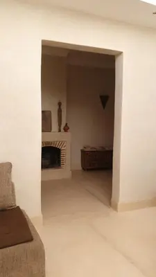 a living room with a fireplace and a couch at SAMA DABACHI Vibrant Medina Loft and Roof top in Marrakech