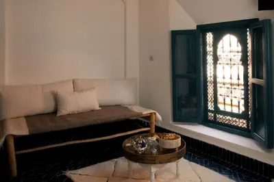 a living room with a couch and a table at Savor Home Authentic Entire Riad with Medina View & Terrace in Marrakech