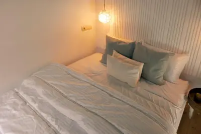 a bed with pillows on it in a room at Savor Home Authentic Entire Riad with Medina View & Terrace in Marrakech