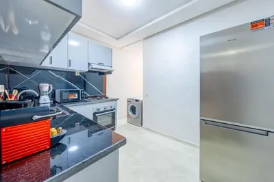 a kitchen with a large stainless steel refrigerator at Comfort and Serenity in the Center of Marrakech in Marrakech