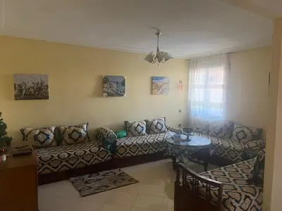 a living room with a couch and a table at Aéroport Menara marrakech in Marrakech