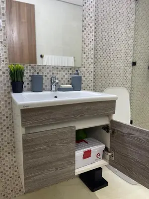a bathroom with a sink and a mirror at Home Star Luxury Apartment Marrakech in Marrakech