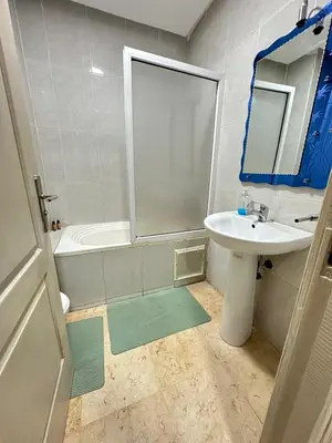 a bathroom with a sink and a toilet and a tub at apartment 9 imm O in Marrakech