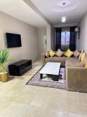 a living room with a couch and a coffee table at apartment 9 imm O in Marrakech