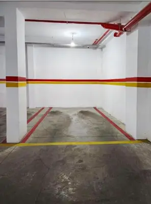 an empty parking garage with colorful stripes on the wall at Marrakech Haven Appartement Familial Wifi HD IPTV Netflix in Marrakech