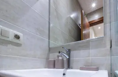 a bathroom with a sink and a mirror at Marrakech Haven Appartement Familial Wifi HD IPTV Netflix in Marrakech