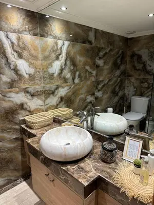 a bathroom with two sinks on a marble counter at Oasis - 7 min from Majorelle - Medina and Nightlife with AC and Pool in Marrakech