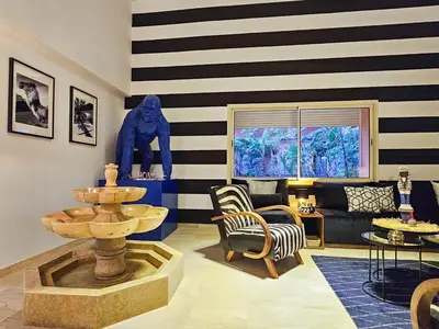 a living room with black and white striped walls at Oasis - 7 min from Majorelle - Medina and Nightlife with AC and Pool in Marrakech
