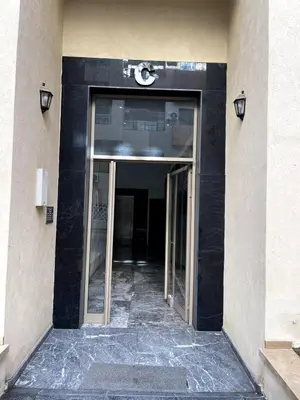 an entrance to a building with a revolving door at Duplex Luxury Appartement in Marrakech
