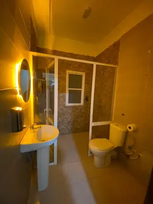 a bathroom with a toilet and a sink at Appartement bros in Marrakech