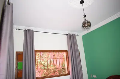 a room with a window and a pendant light at Maison Marrakech in Touggana