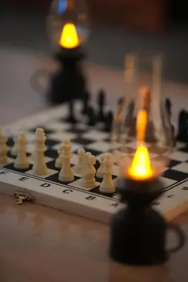 a chess board with white chess pieces on it at Dar sultane in Marrakech