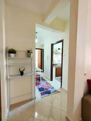 a living room with a staircase in a house at Stylish & Bright Apartment in Marrakech
