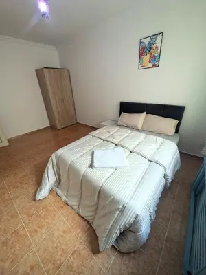 a bedroom with a large bed in a room at Cozy studio in a good location in Marrakech