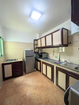 a kitchen with a refrigerator and a counter top at Cozy studio in a good location in Marrakech