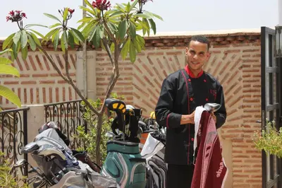 a man standing next to a group of motorcycles at Riad La Villa Marrakech in Marrakech