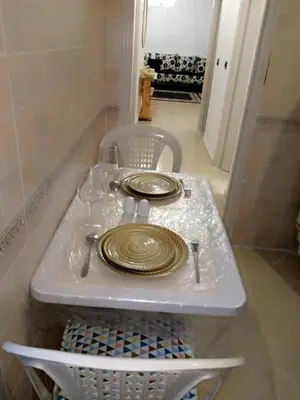 a plate sitting on top of a shelf in a room at Appartement cosy in Marrakech