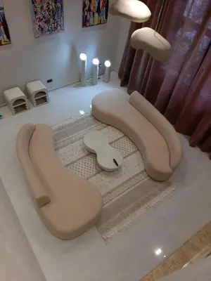 a living room with a couch and chairs on a rug at Majestic Duplex - Luxe et Confort au Cœur de Marrakech in Marrakech