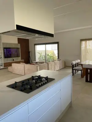 a kitchen with a stove top in a living room at Villa Rana in Marrakech