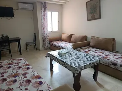 a living room with a couch and a table at family apartment 34 in Marrakech