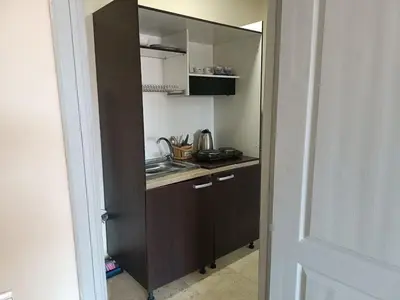 a small kitchen with a sink and a counter at family apartment 34 in Marrakech