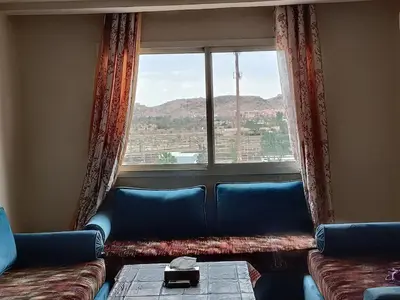 a living room with a couch and a window at family apartment 31 in Marrakech