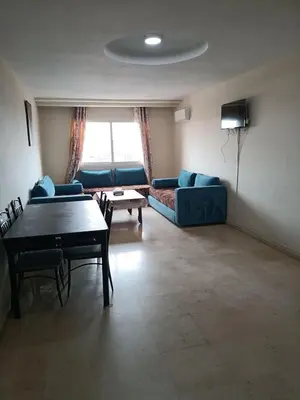 a living room with a couch and a table at family apartment 31 in Marrakech
