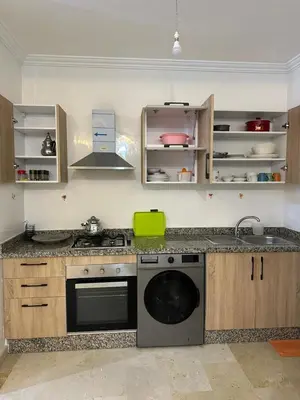 a kitchen with a sink and a dishwasher at Appartement a gueliz Marrakech in Marrakech